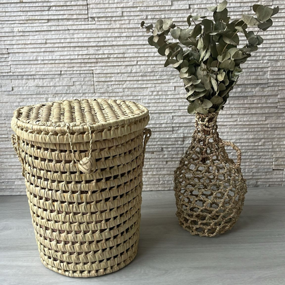 Petite malle ronde en feuilles de palmier