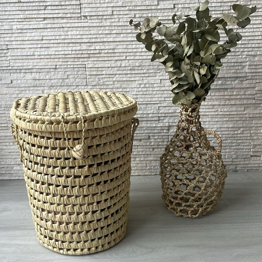 Petite malle ronde en feuilles de palmier
